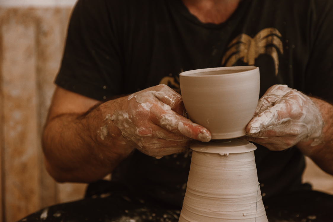 A Person Making a Clay Pot 