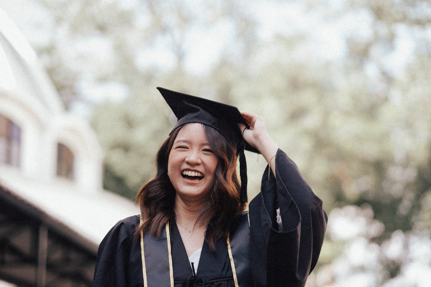 Smiling Female Graduate Wearing a Mortarboard